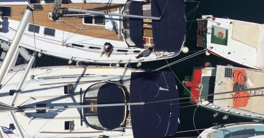 Sailing yacht with colorful sails