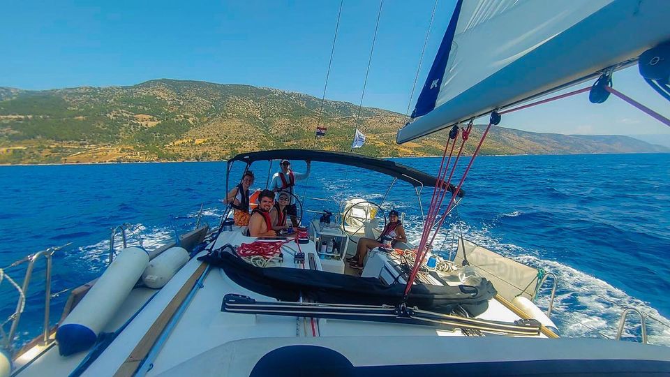 A group of people sailing in the turquoise waters of Croatia
