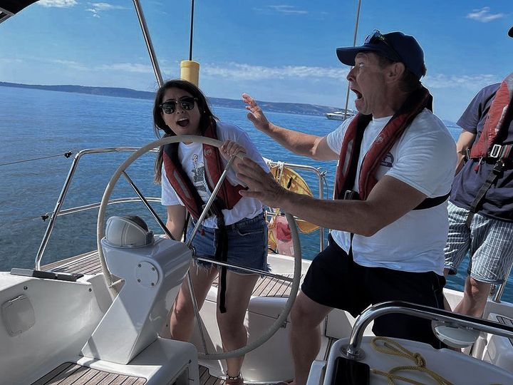 "Sailors enjoying the sun and wind while sailing in Croatia"